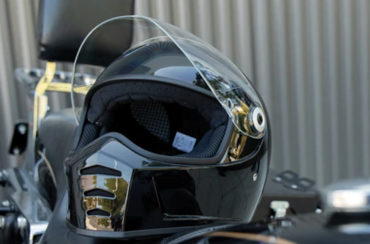 A motorcycle helmet sitting alone without a rider.