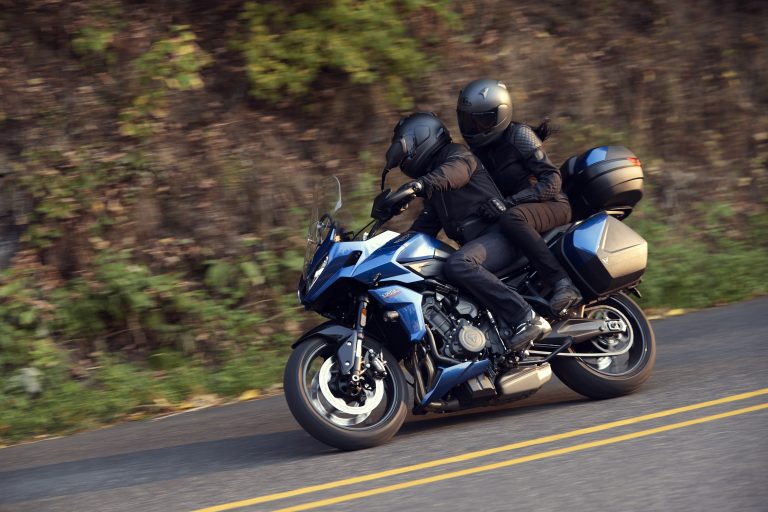 2022 Triumph Tiger Sport 660 riding on a two-lane highway
