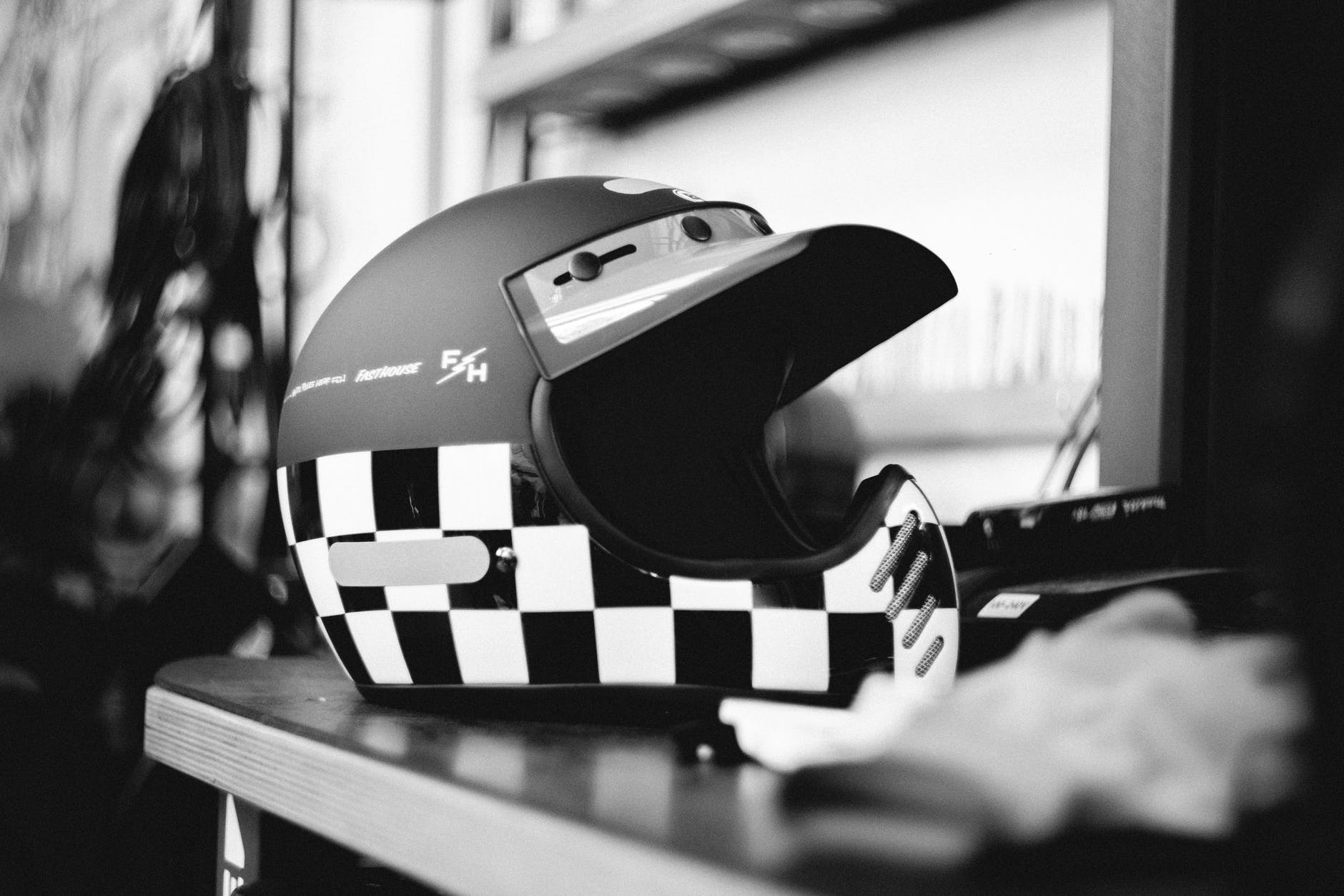 black and white photography of motorcycle helmet