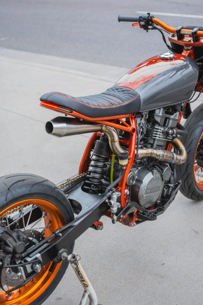485 Designs Custom Kawasaki KLR650 features a single exhaust the exits under the seat.