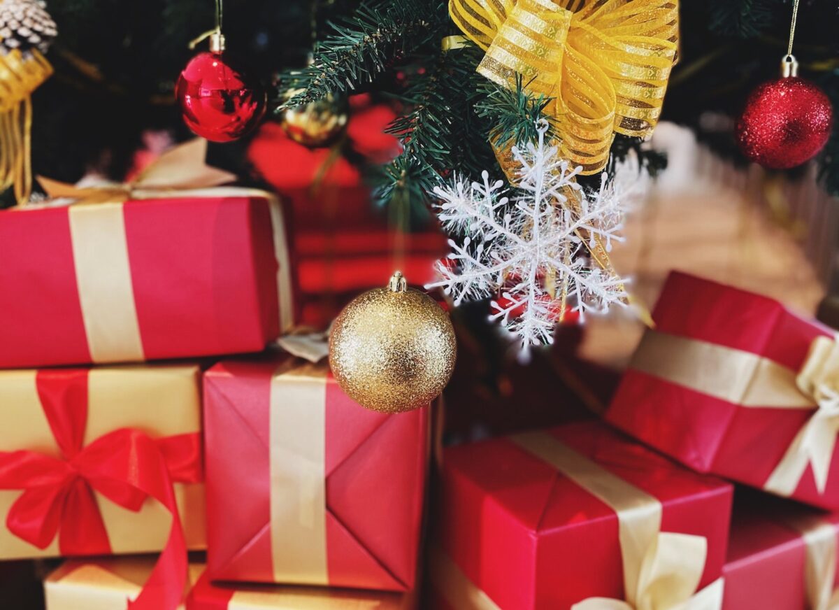 motorcyclist holiday gift guide presents under a christmas tree