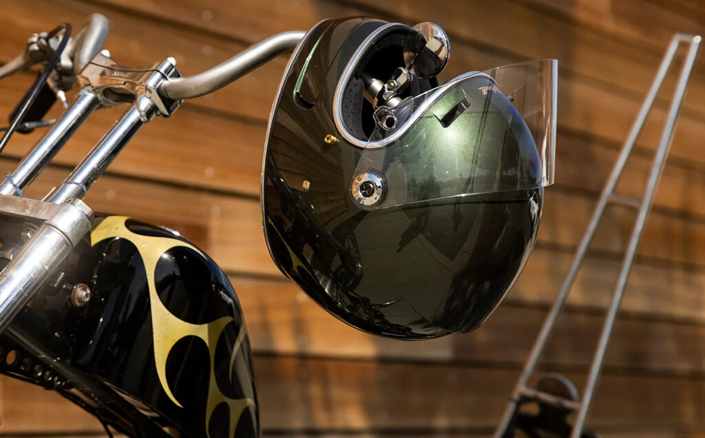 motorcycle helmet sitting on some motorcycle handlebars