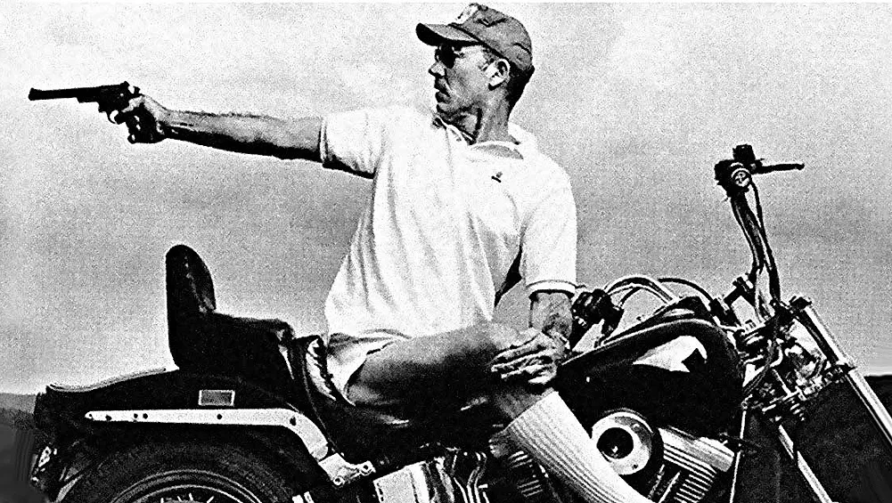 Hunter Thompson, the author of Hell's Angels, riding a Harley Davidson Motorcycle