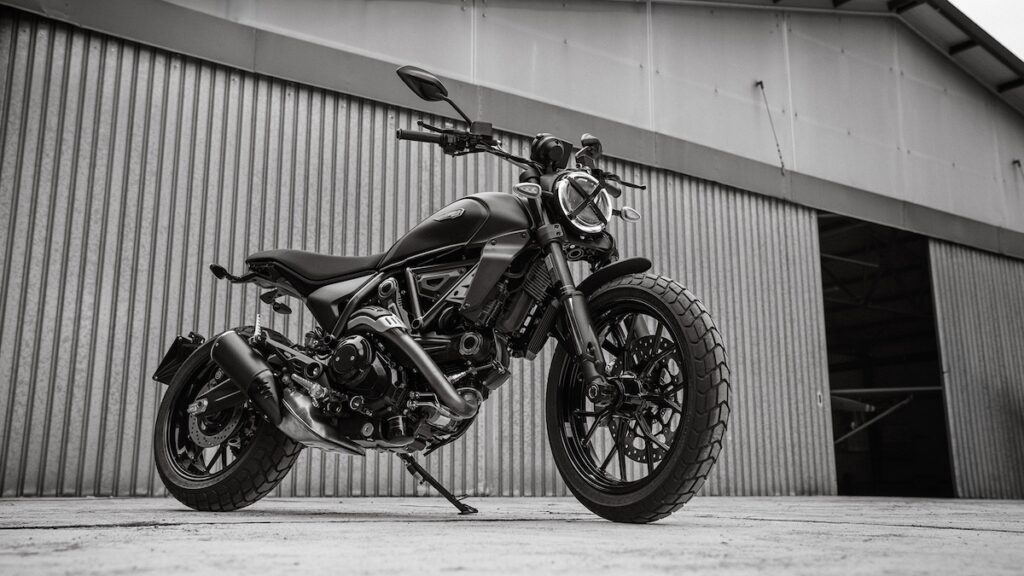 Ducati Scrambler Icon Dark parked in front of a building