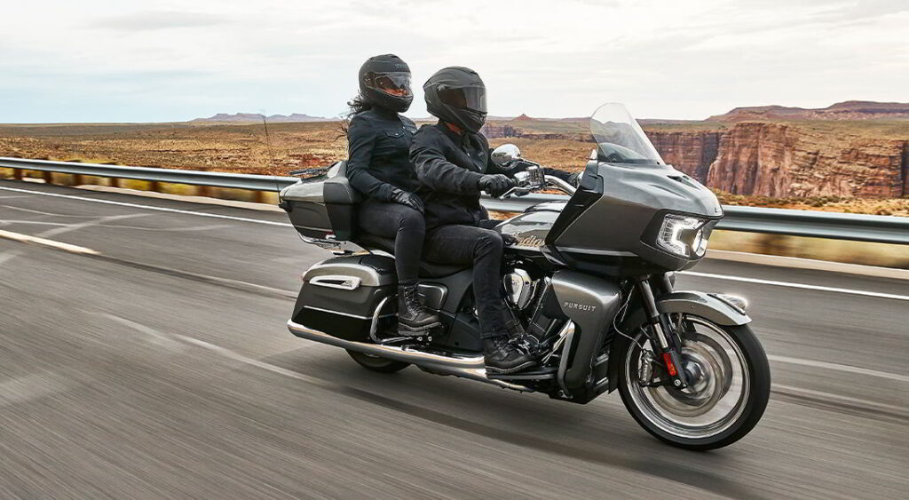 A motorcyclists wearing a helmet with a pinlock lens insert while riding.