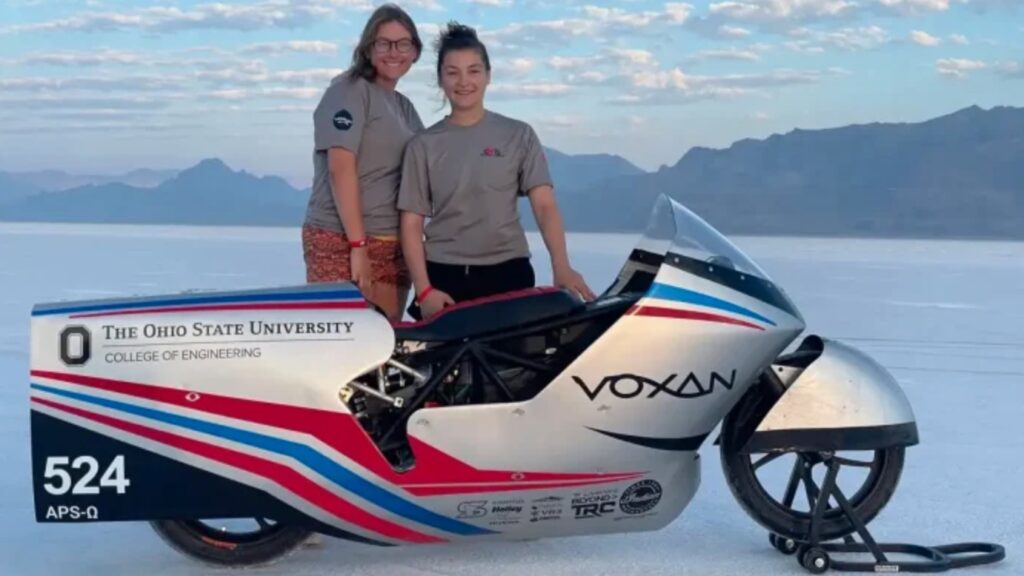 Bonneville Motorcycle Speed Trials racers standing next to their bike