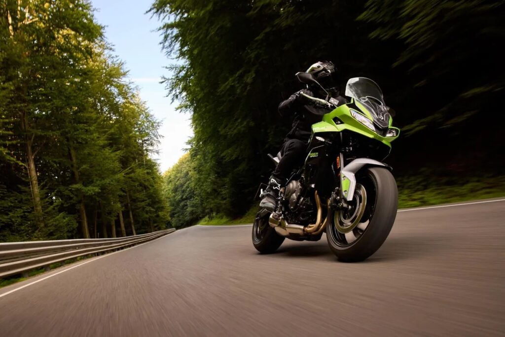 2025 Triumph Tiger Sport 660 riding on a country road.
