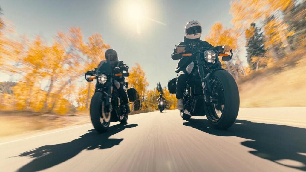 Multiple 2025 LiveWire S2 Alpinista electric motorcycle riding on a country highway