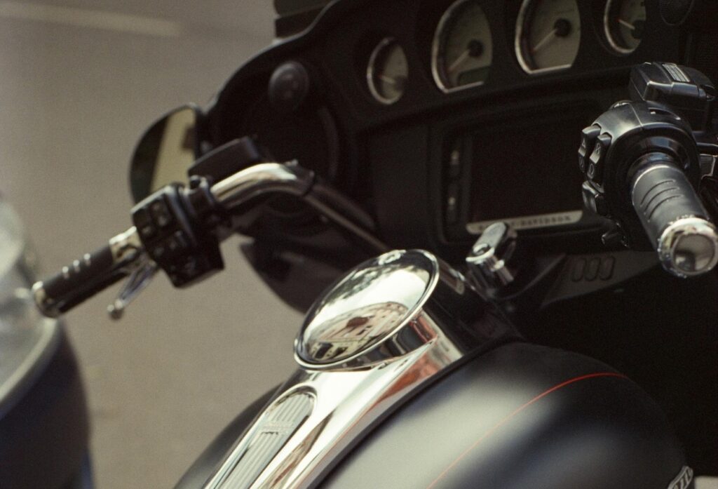 A Harley-Davidson motorcycle with some brand new grips on the handlebars