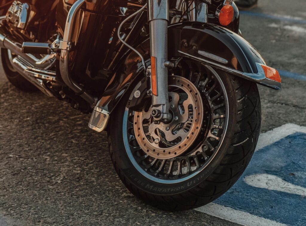 A motorcycle front tire on a harley-davidson motorcycle