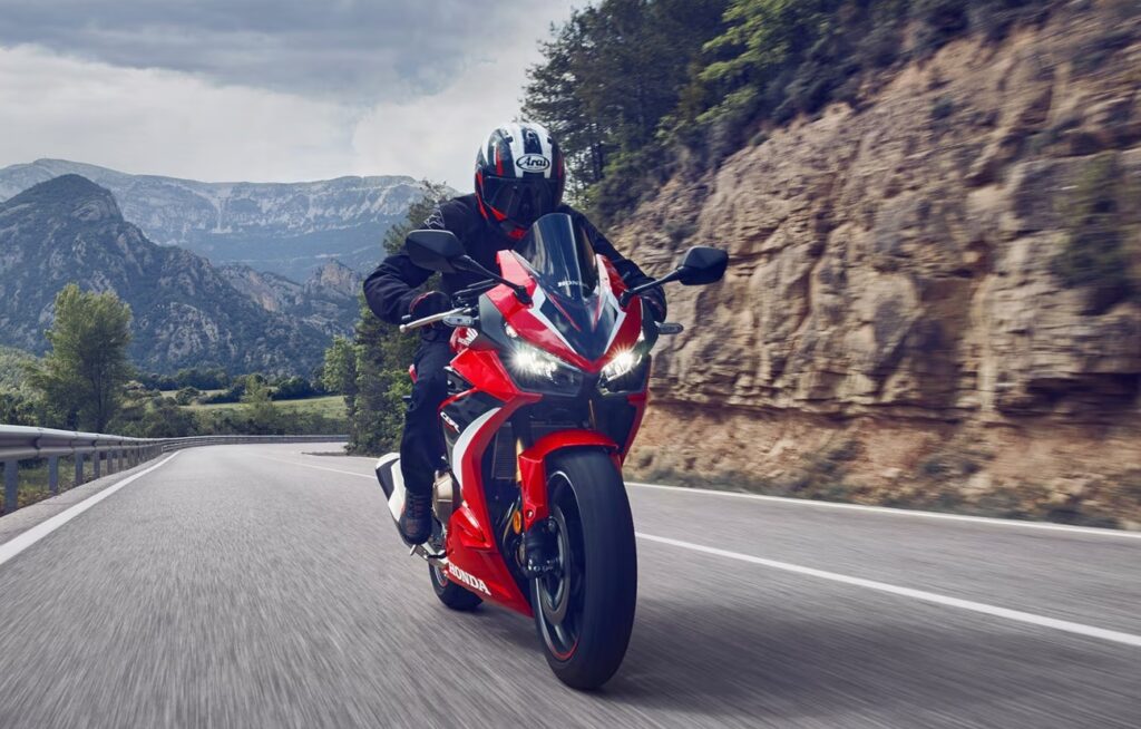Honda CBR motorcycle on a mountain road.