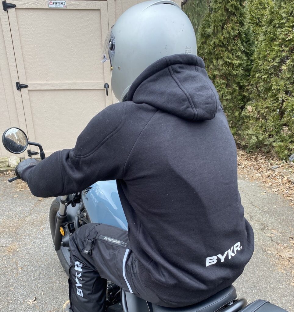BYKR Motorcycle Hoodie on a motorcycle from the back