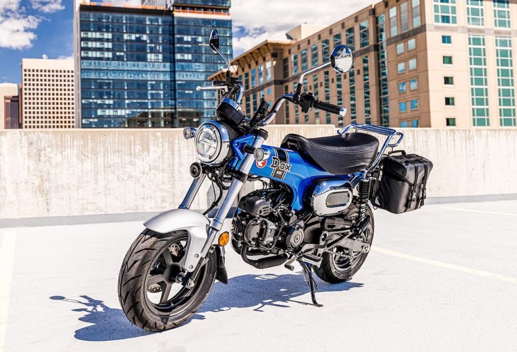 Honda Dax 125 parked on top of a parking garage