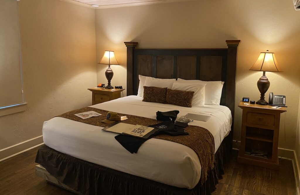 The bed in a lodge room at Tapoco Lodge