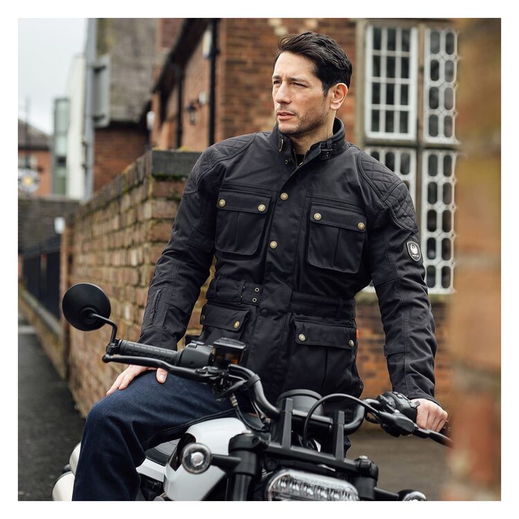 A rider wearing a blck Merlin Burslem D30 Eco Laminated Jacket