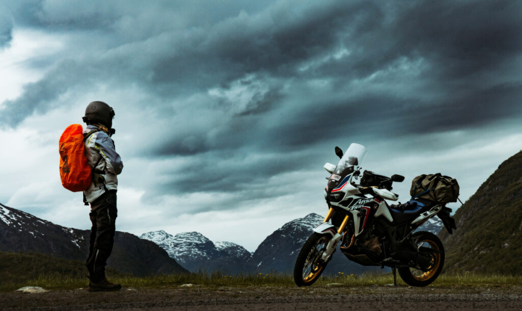 A motorcycle rider packed up and ready for a road trip.
