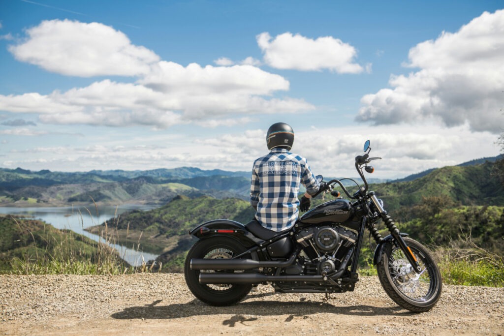 Harley rider sitting on their bike.
