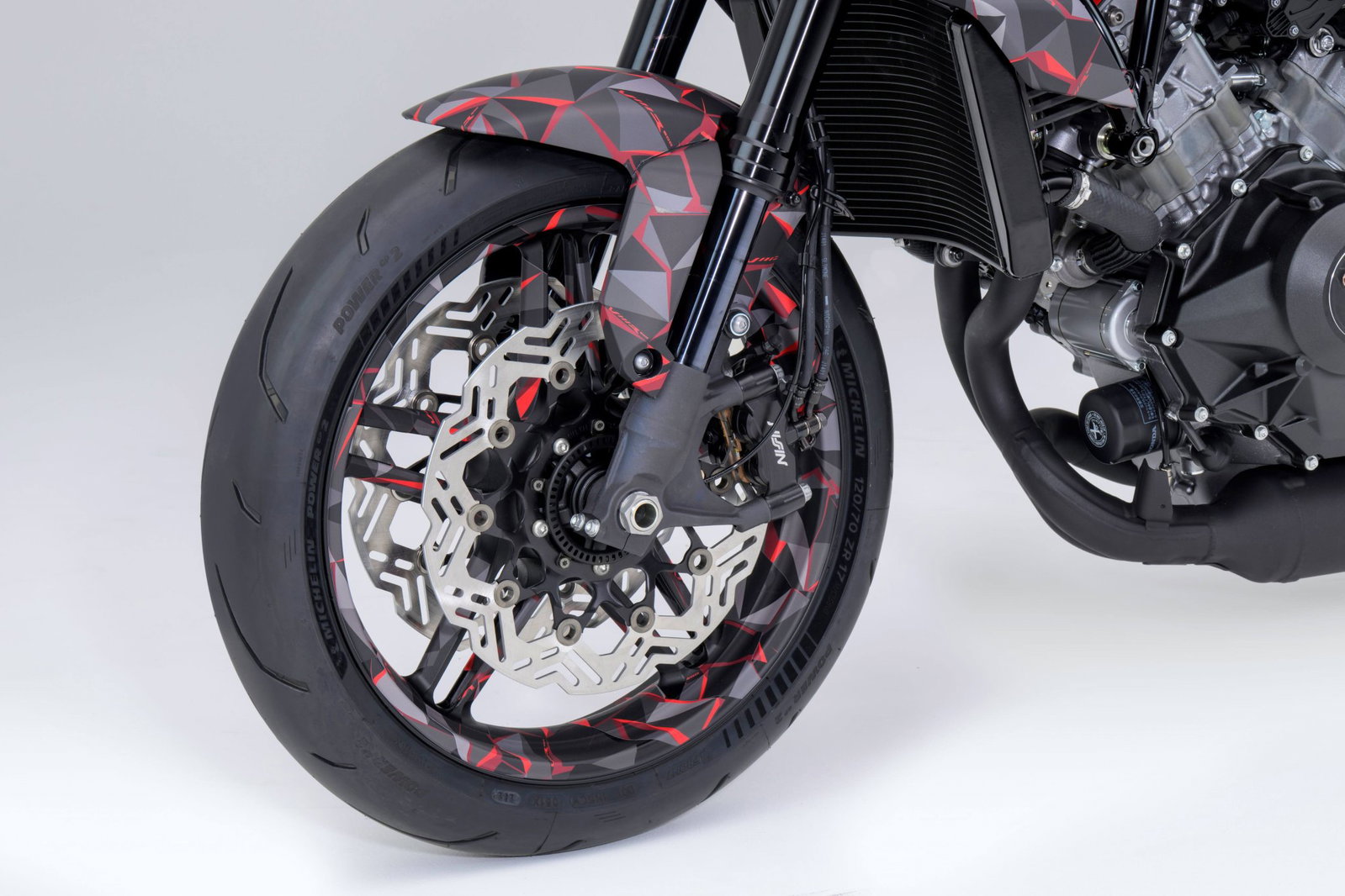 Honda V3R 900 E-Compressor prototype displayed at EICMA showing the exposed 75-degree V3 engine and electronic compressor